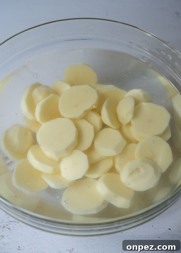 Potato slices soaking in water.
