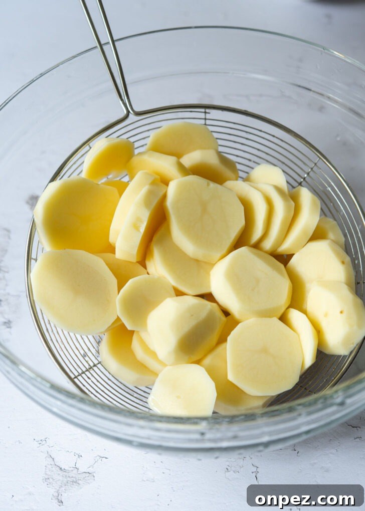 Potato slices drained through strainer.