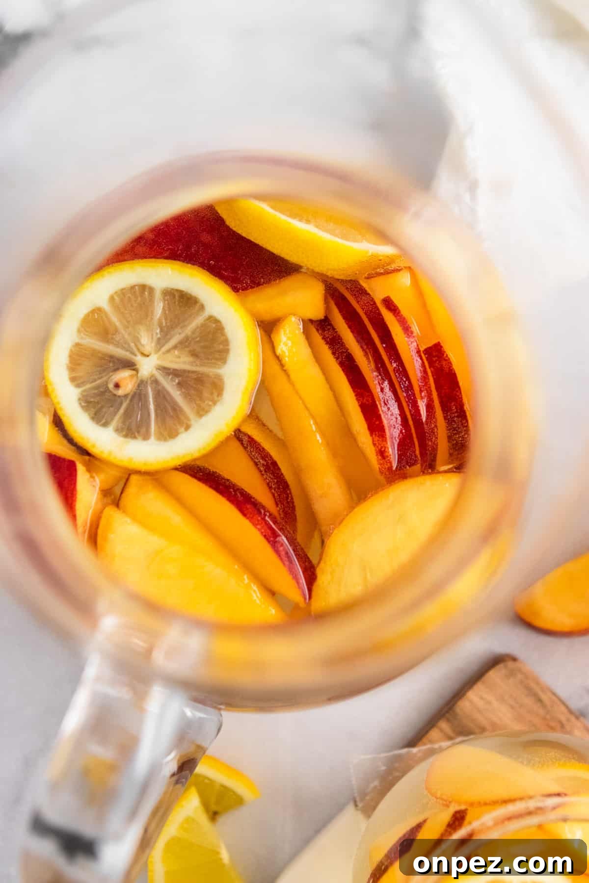 Ginger Peach White Wine Sangria Recipe 5 Overhead view of pitcher of peach white sangria.