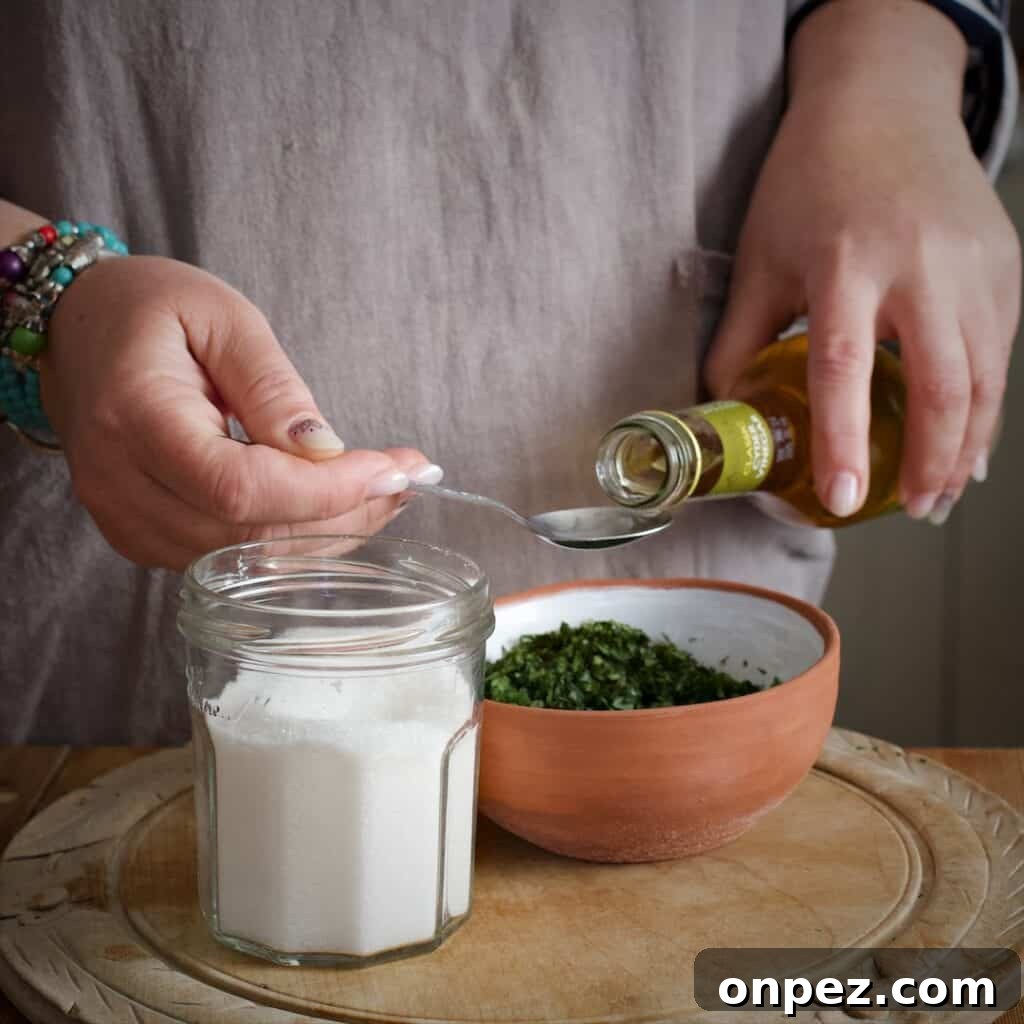 Homemade Mint Sauce Recipe for Lamb and Roasts 6 Measuring apple cider vinegar over a terracotta bowl of mint leaves