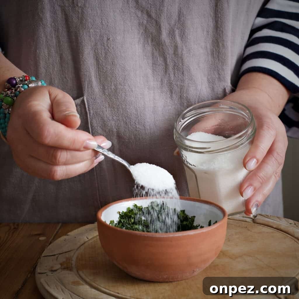 Homemade Mint Sauce Recipe for Lamb and Roasts 7 Scattering sugar over a small bowl of fresh mint sauce ingredients
