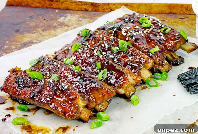 Sticky Asian Baked Pork Ribs Recipe 4 Sticky Asian Baked Pork Ribs on metal baking sheet