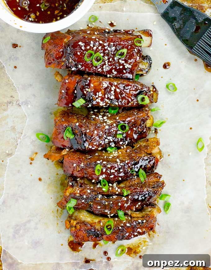 Sticky Asian Baked Pork Ribs Recipe 7 Sticky Asian Baked Pork Ribs shown vertically