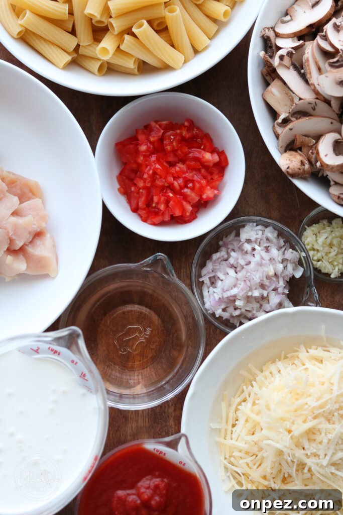 ingredients for making creamy tomato chicken and mushroom pasta 