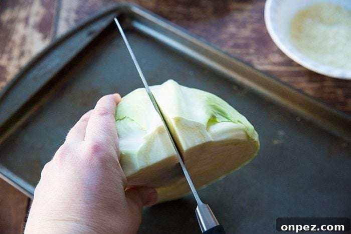 Cut each half of cabbage in half again.