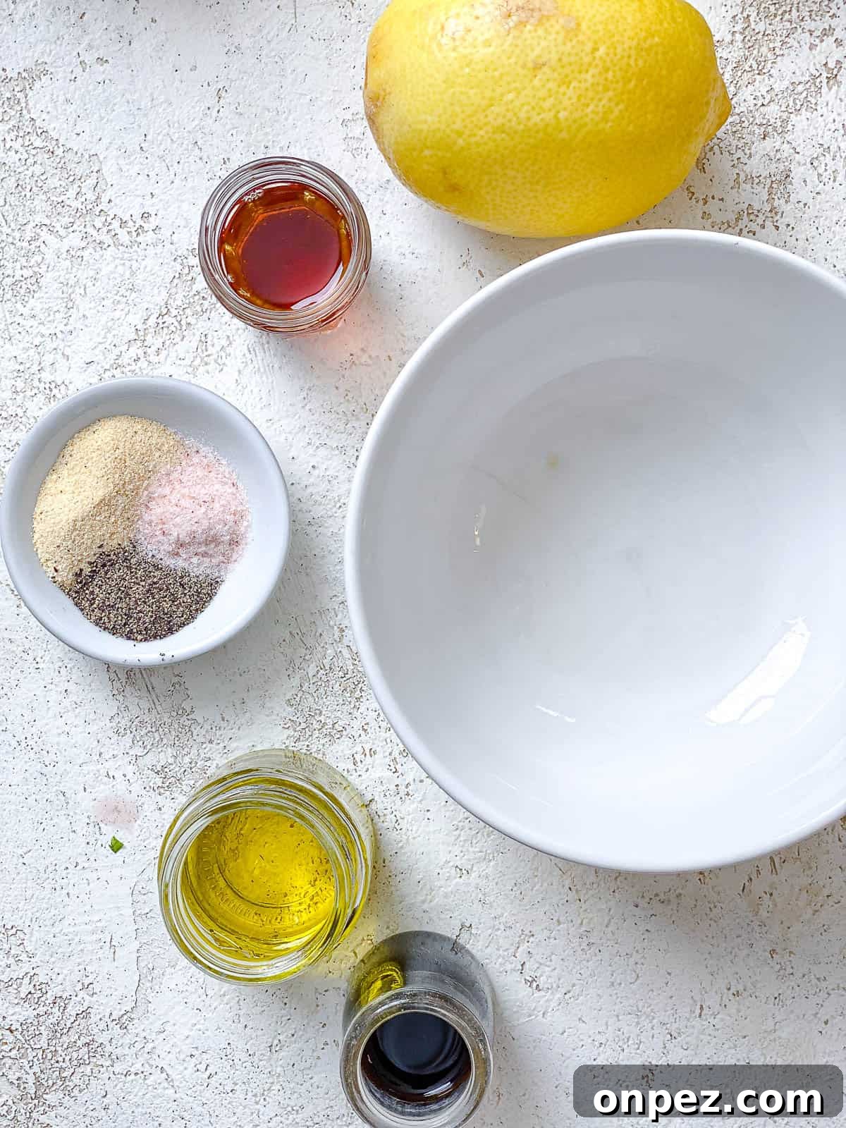 ingredients for Mediterranean Couscous Salad measured out against a white surface