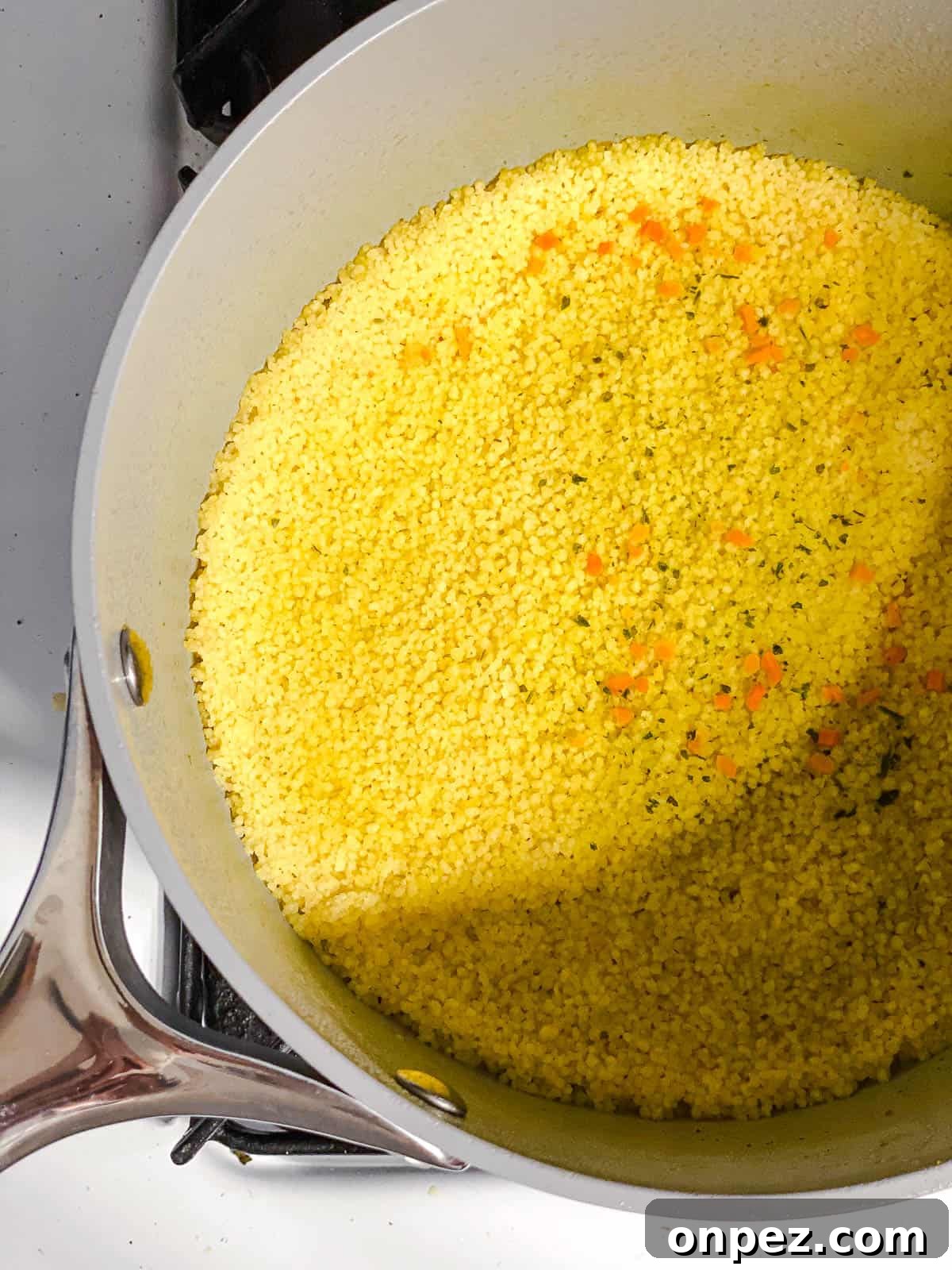 process shot of couscous cooking in pot