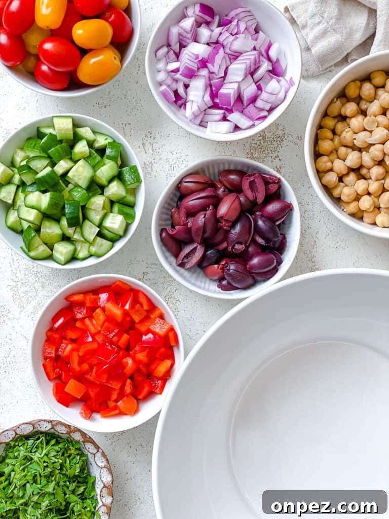 ingredients for Mediterranean Couscous Salad measured out against a white surface