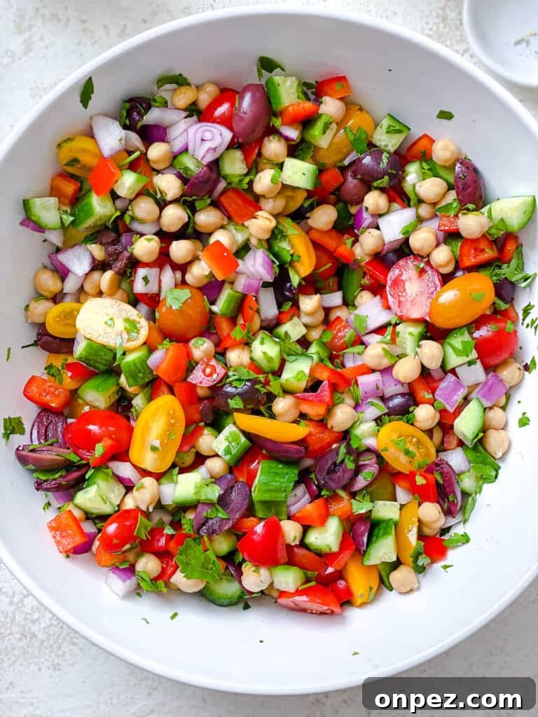 process shot of veggies being added to a white bowl