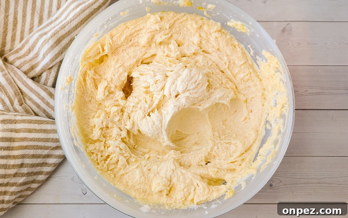 Lemon Poppy Seed Cookies with Bright Zesty Flavor 4 a bowl of creamy butter, sugar, and eggs beaten together.