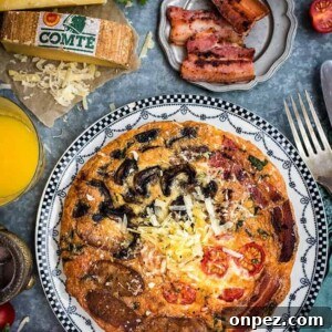 Fully Loaded Breakfast Frittata with Comté Cheese, Bacon, Sausages, Tomatoes and Mushrooms