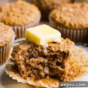 Moist Honey Bran Muffins Recipe 11 Honey bran muffin with a pat of partially melted butter on top