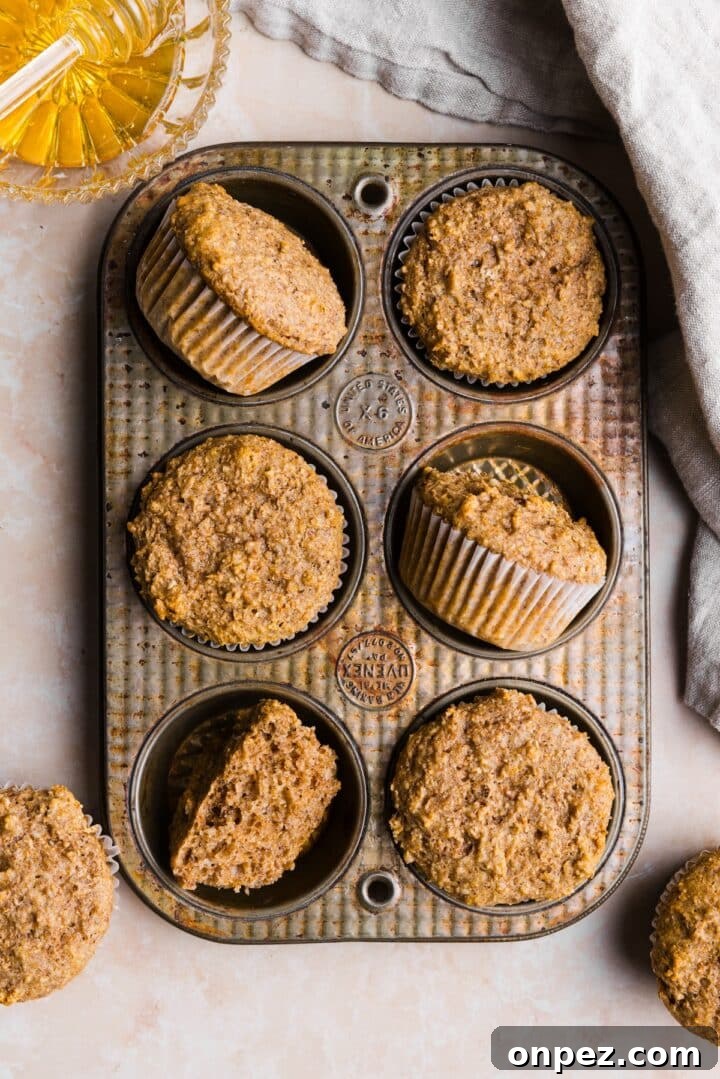 Moist Honey Bran Muffins Recipe 3 Honey bran muffins in a metal baking pan