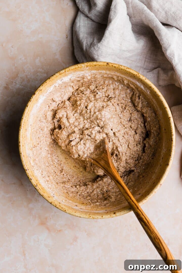 Moist Honey Bran Muffins Recipe 7 Dry and wet ingredients mixed into a muffin batter in a large mixing bowl