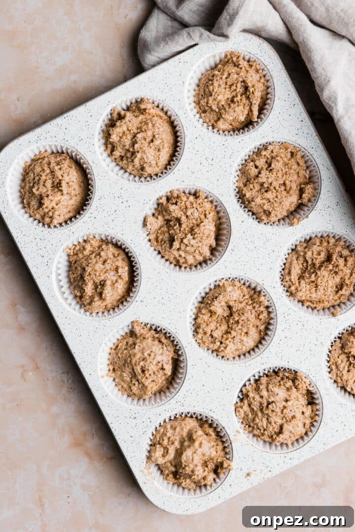Moist Honey Bran Muffins Recipe 8 Raw muffin batter in a 12-cup muffin tray