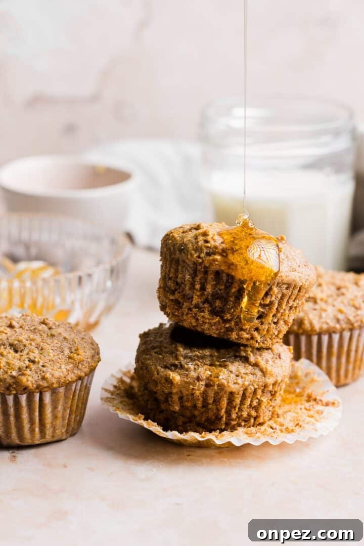 Moist Honey Bran Muffins Recipe 10 Honey bran muffins stacked a drizzled with honey