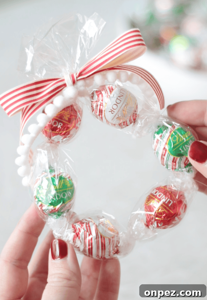 hands holding chocolate truffle wreath