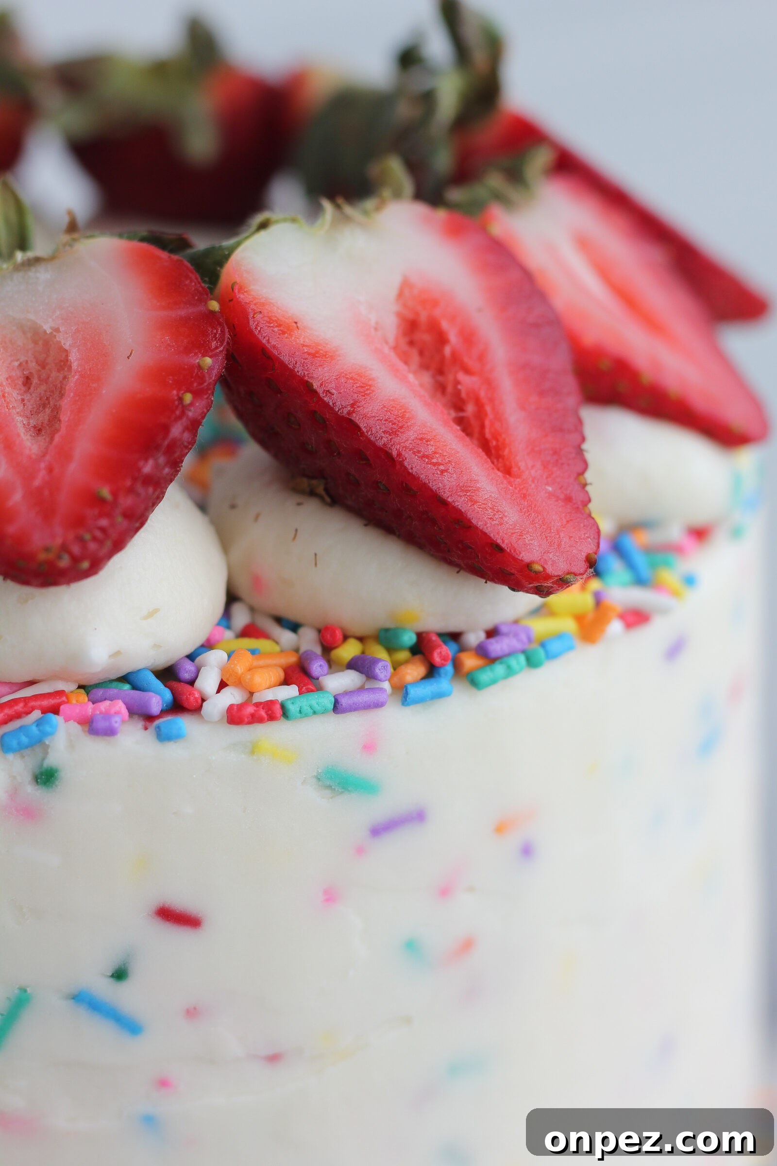 Applying sprinkles to cake