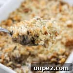 Close up of a spoonful of Mushroom Gratin.