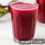 Close up of a glass of beet juice.