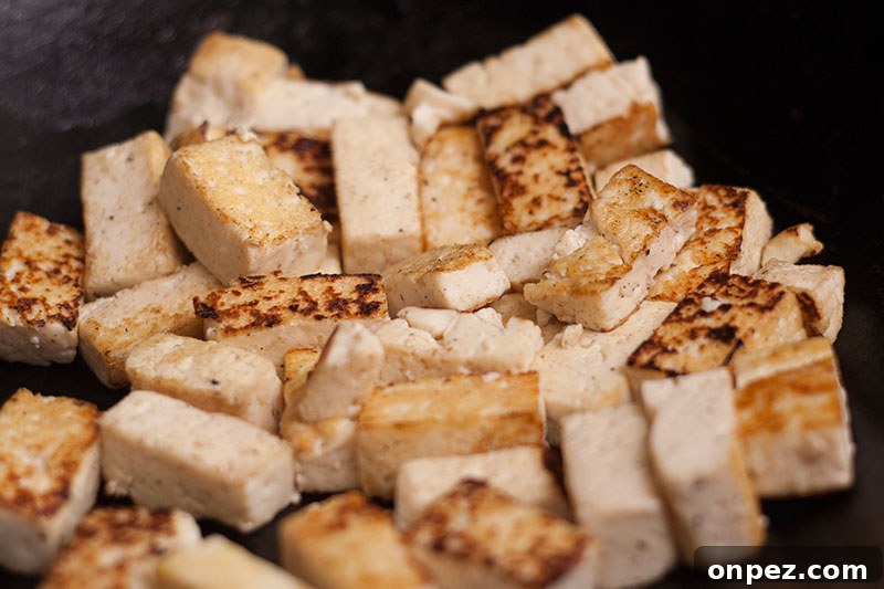 Stir fried tofu in a wok