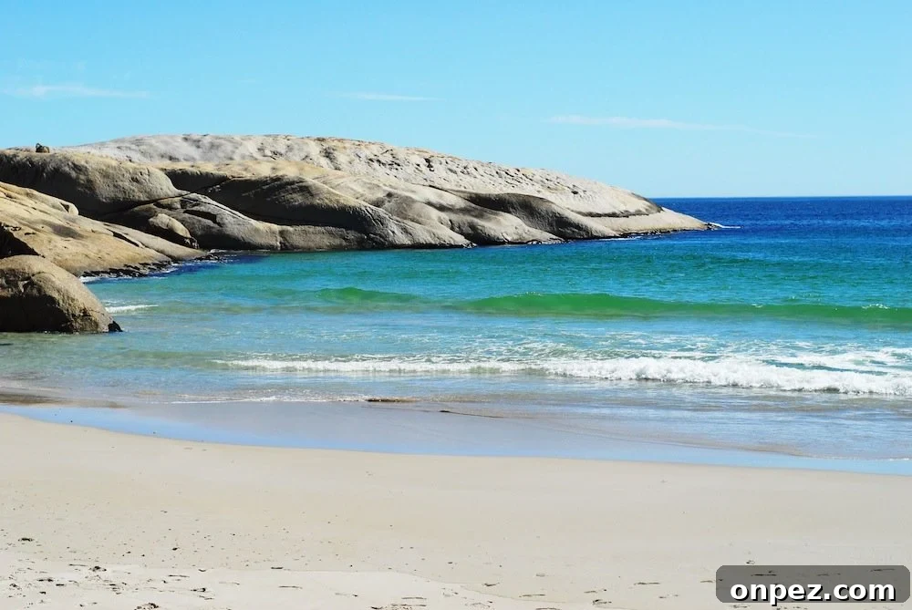 Sunday at Llandudno Beach: Sights and Activities 2 Sandy beach with clear water and distant cliffs