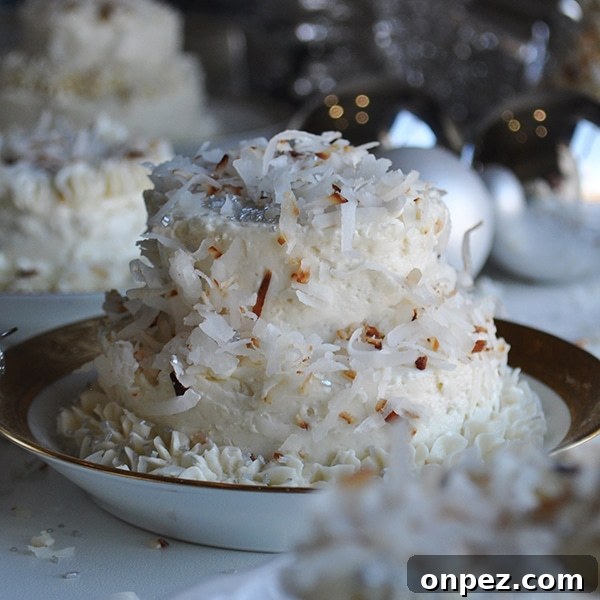 Mini Coconut Cakes with Maple Coconut Italian Meringue 4 A mini Coconut Layer Cake frosted with Maple Italian Meringue Buttercream.