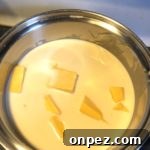 Grandma's Macaroni and Cheese Recipe 13 Heat milk and cheese together