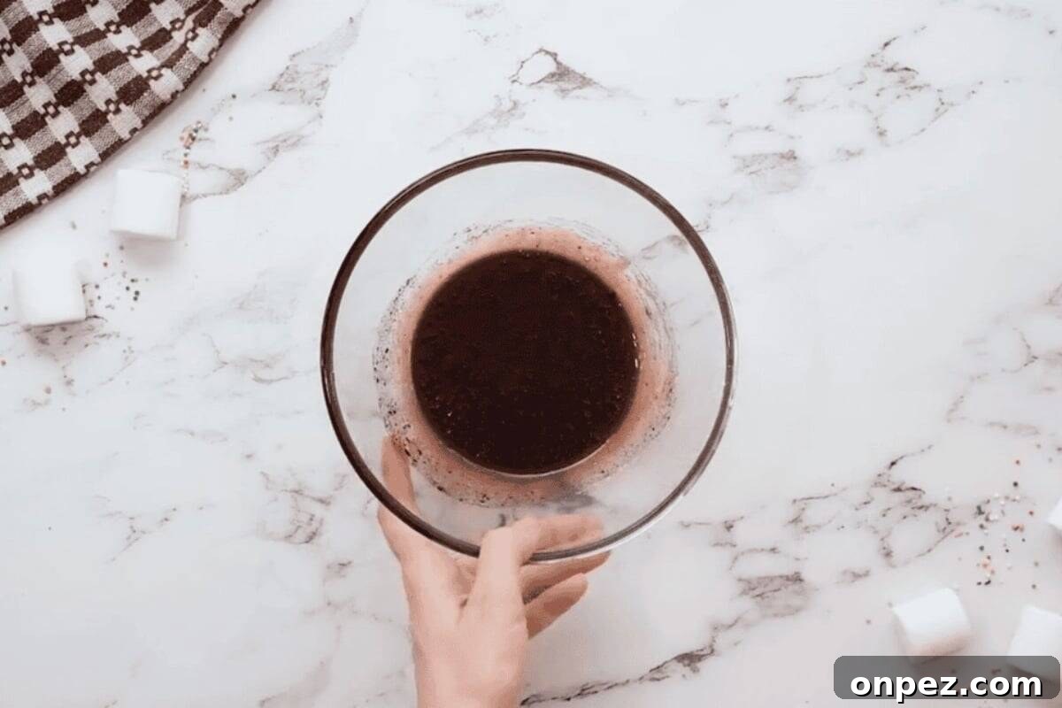 Hot Cocoa Cookies Recipe: Rich Chocolate Chip Cookies 11 melted chocolate in a glass bowl.