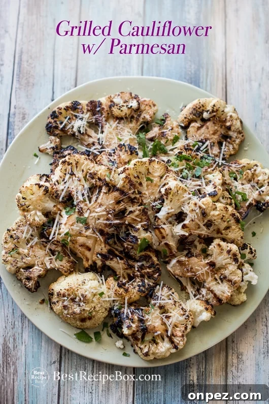 Garlic grilled cauliflower with parmesan cheese on a plate