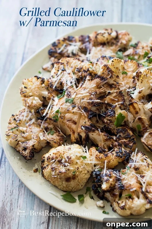 Garlic grilled cauliflower with parmesan cheese on a plate