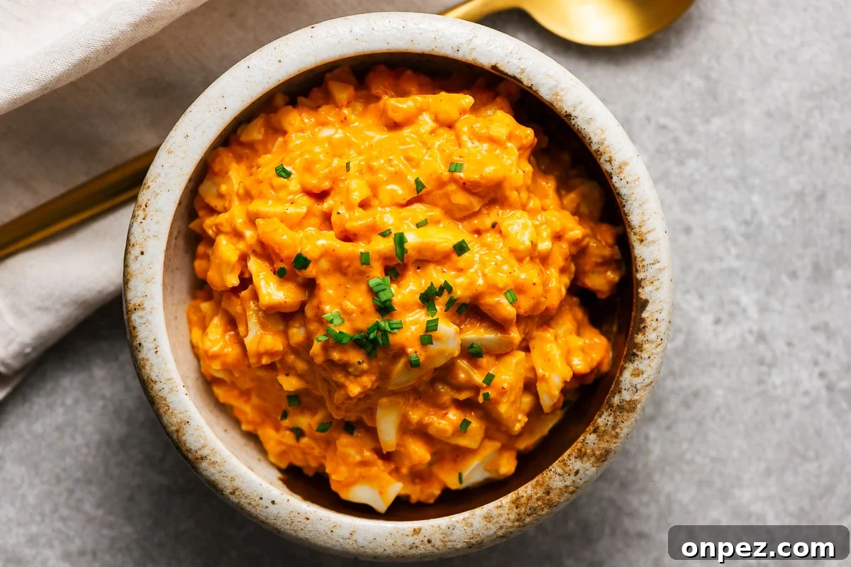 A bowl with creamy gochujang egg salad.