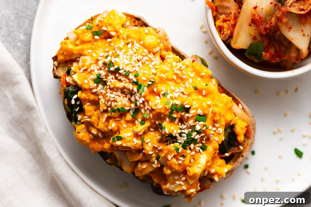 Creamy and spicy gochujang egg mayo on sourdough bread with kimchi.