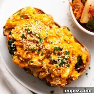 Spicy gochujang egg on toast sprinkled with sesame seeds and chives.