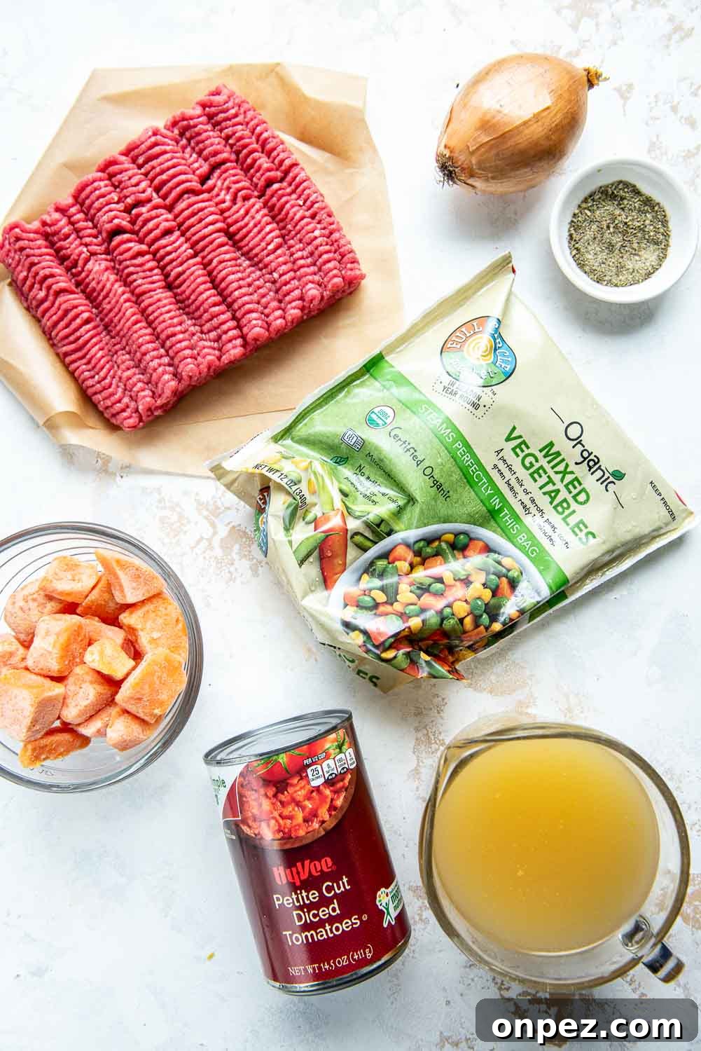 Ground beef, petite cut diced tomatoes, bone broth, mixed vegetables and 1 shallot