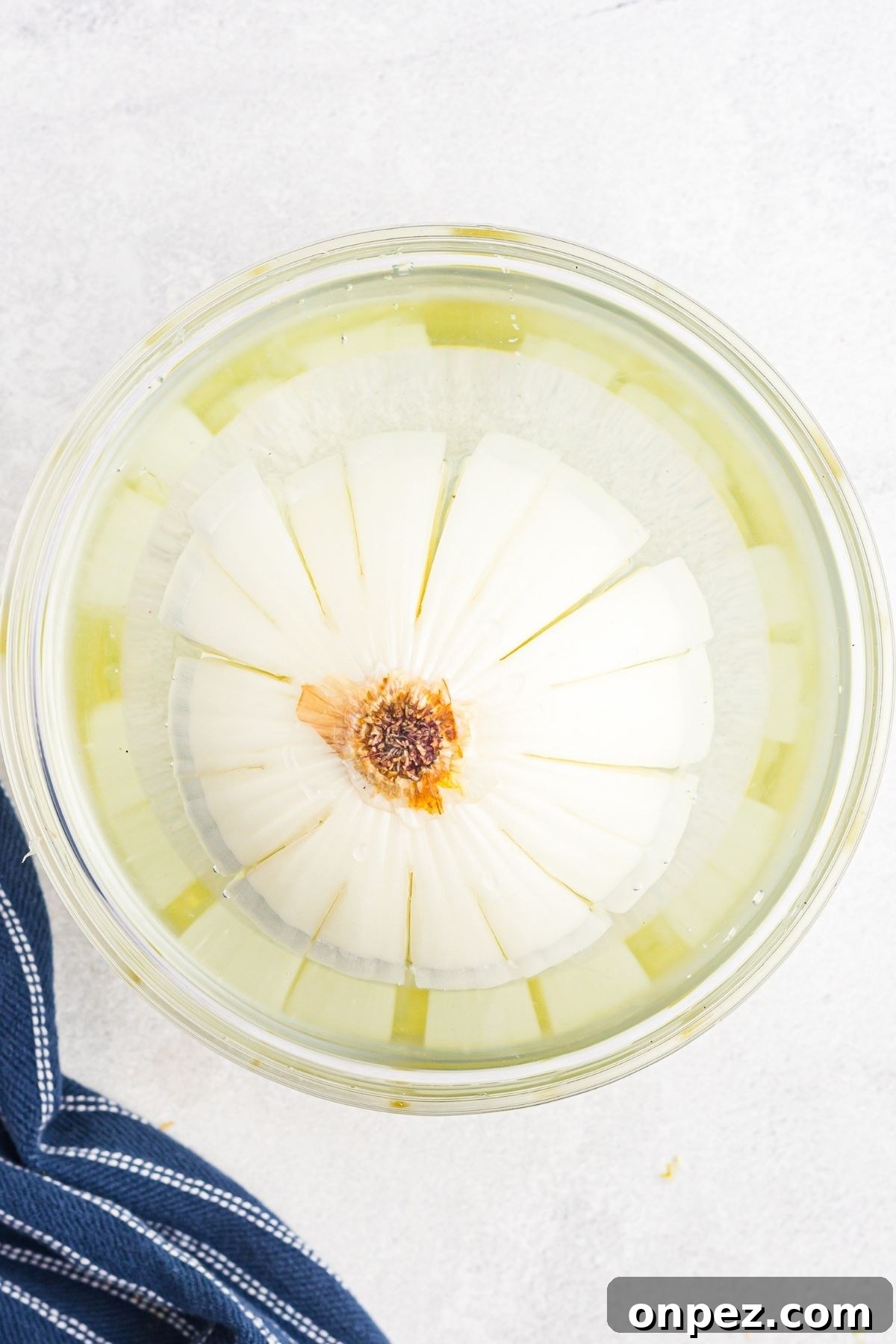 Sliced onion soaking in cold water