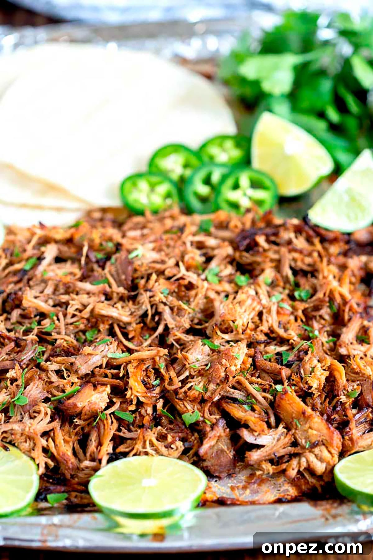 Instant Pot Pork Carnitas Recipe with Crispy Edges 2 Shredded beef carnitas with crispy tops on a sheet pan
