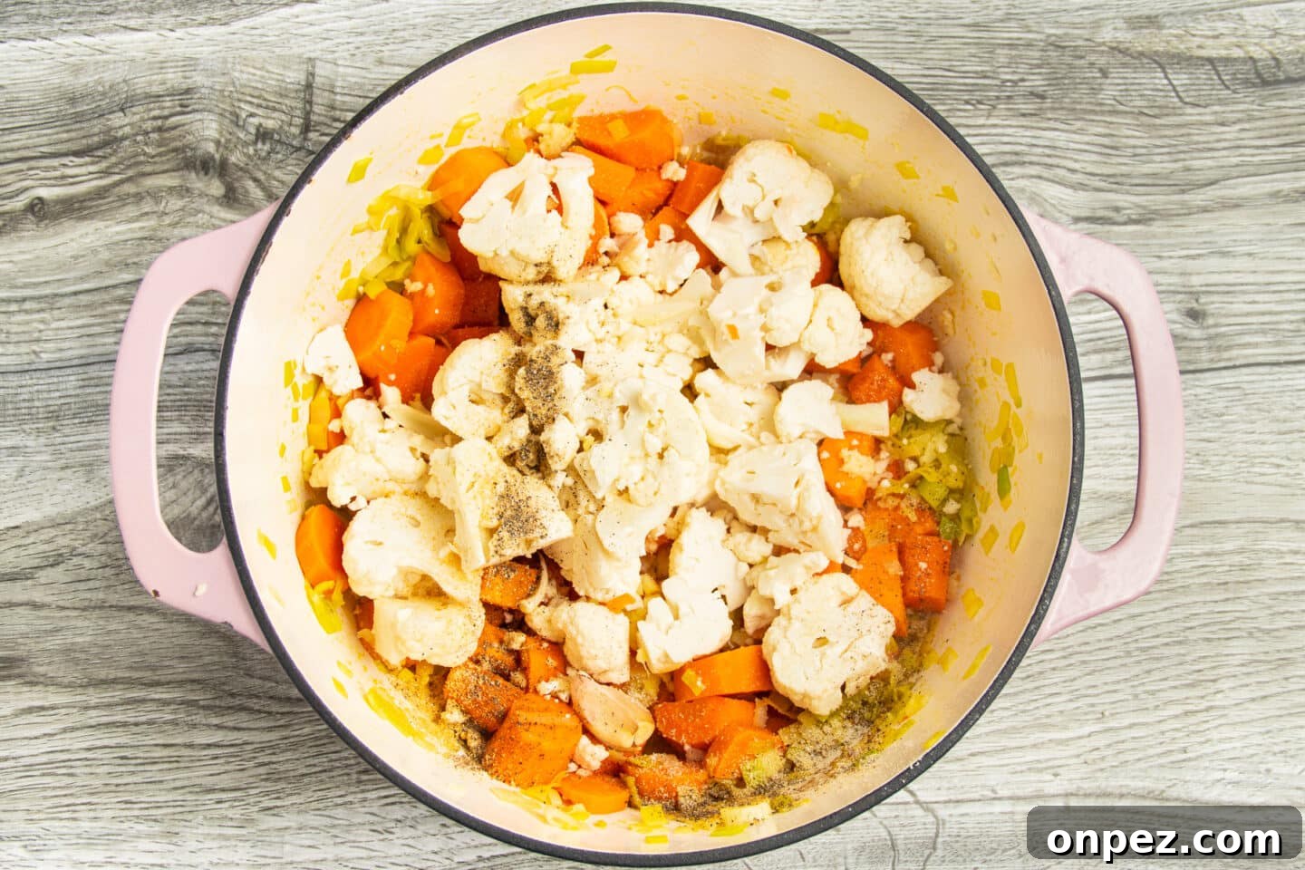 Roasted Carrot and Cauliflower Soup Recipe 5 Leeks and carrots with cauliflower and spices added.