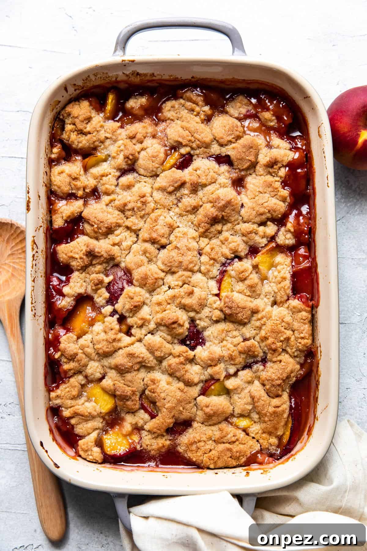 Scoop of peach cobbler with ice cream
