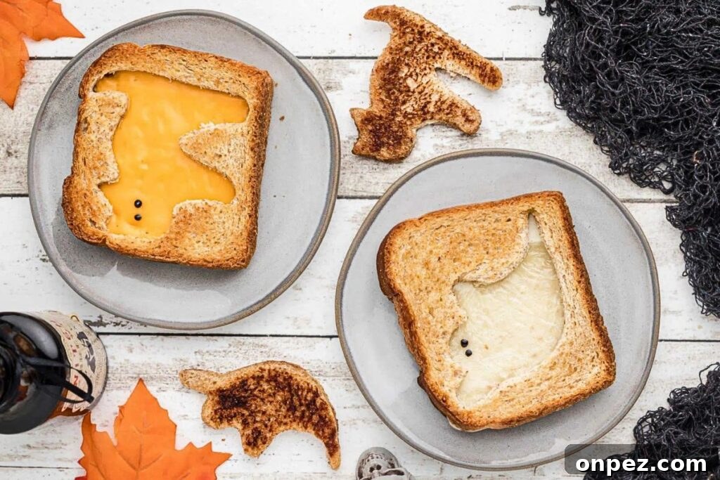 Grilled cheese sandwiches with Halloween shapes cut out.