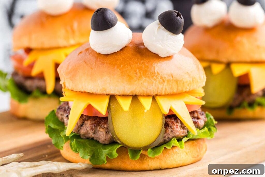 Burger that set up like a monster with a pickle hanging out.