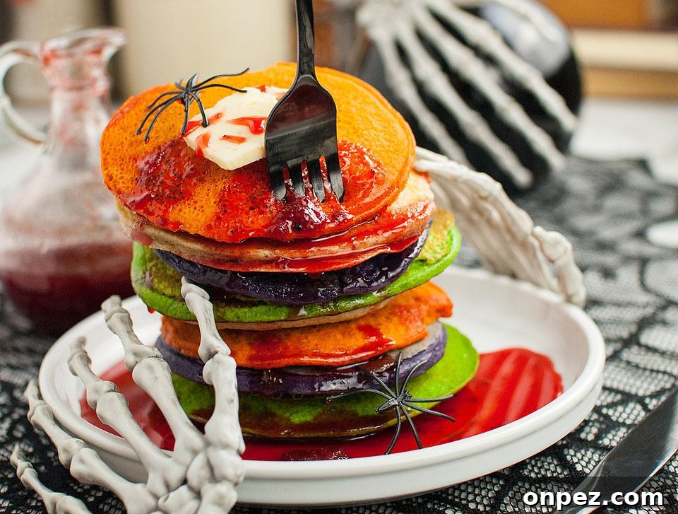Colourful Halloween Pancakes with red sauce on top