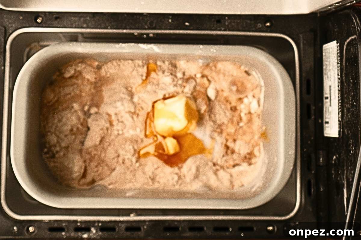 Honey Wheat Bread Recipe for Bread Machines 3 ingredients layered in bread machine.