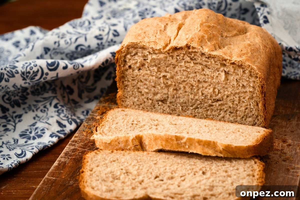 Honey Wheat Bread Recipe for Bread Machines 6 honey wheat bread loaf with two slices cut.
