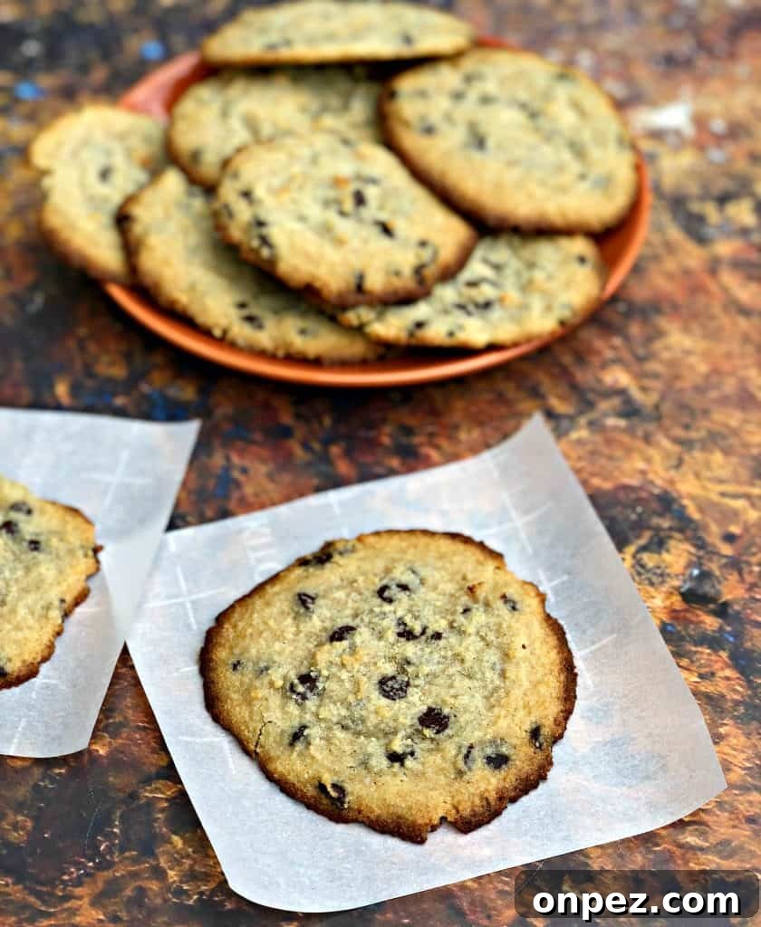keto chocolate chip cookies on a plate with a glass of milk